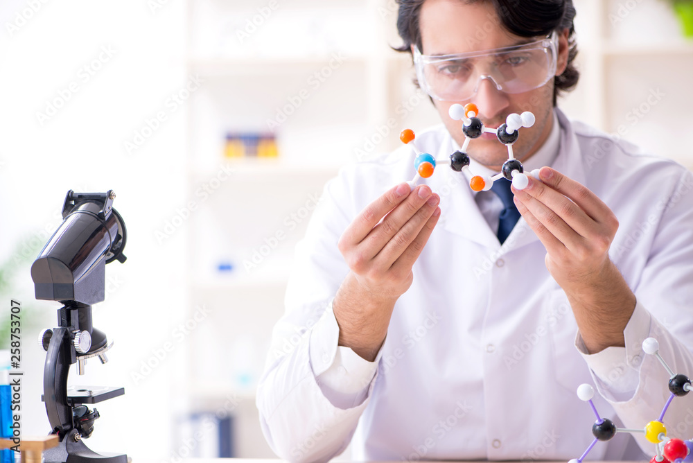 Young male scientist working in the lab Young male scientist working in the lab