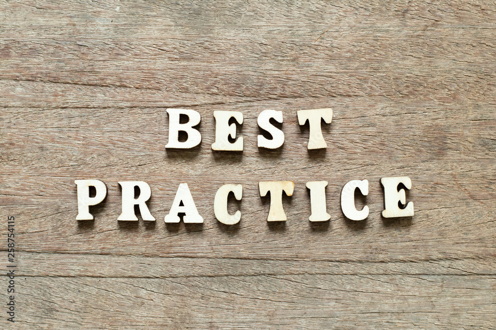 Letter block in word best practice on wood background Letter block in word best practice on wood background