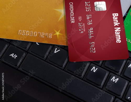 Laptop keyboard and bank credit cards. Business concept