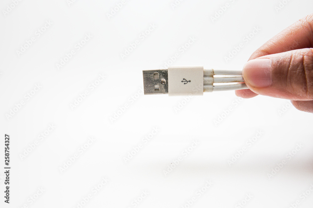 Old three way usb phone charging cable isolated on white Old three way usb phone charging cable isolated on white