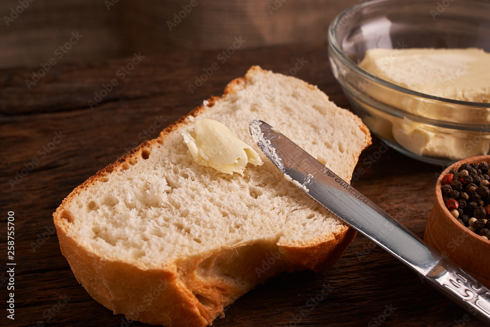 Bakery - gold rustic crusty loaves of bread and buns on black chalkboard background. Still life captured from above Bakery - gold rustic crusty loaves of bread and buns on black chalkboard background. Still life captured from above
