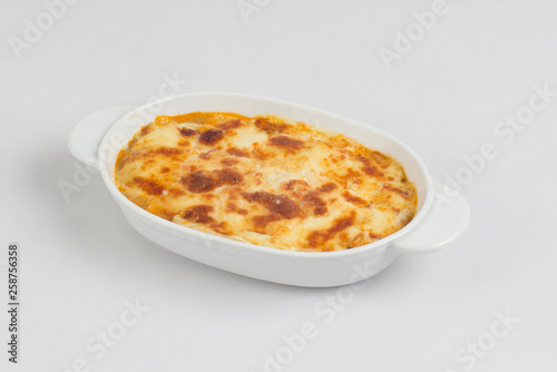 Lasagna in baking dish isolated on white © venusangel
