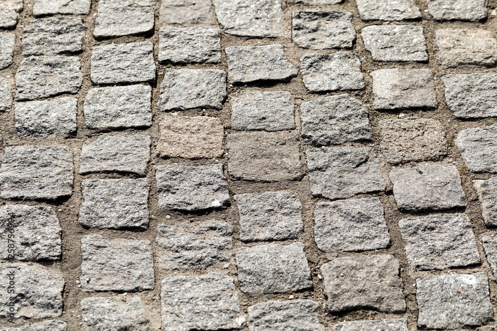 Background from equal ranks of a square stone on a floor. Floor stone blocks in the long term Background from equal ranks of a square stone on a floor. Floor stone blocks in the long term