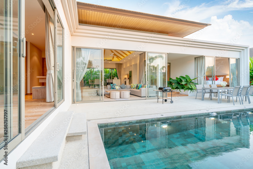 home or house Exterior design showing tropical pool villa with greenery ...