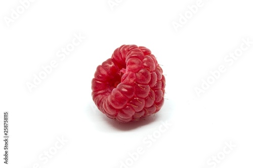 Raspberries over white background