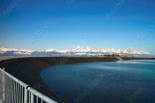 The most famous Slovak peak in the High Tatras - Krivan. A view of the Cierny Vah hydroelectric power plant. photo