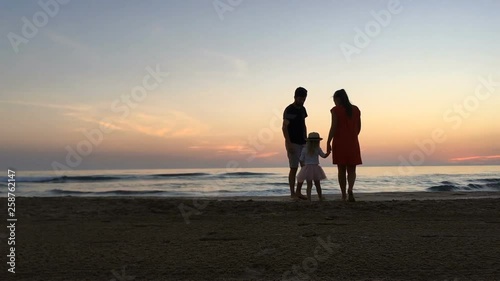 Happy family have fun on the beach.