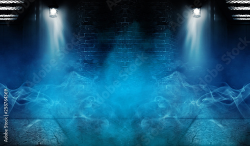 Background of an empty building with brick walls  illuminated by spotlights. View of open elevator doors. Neon light smoke.