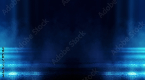 Background of empty dark room with rays of light. Concrete floor with light reflection. Smoke, neon blue light