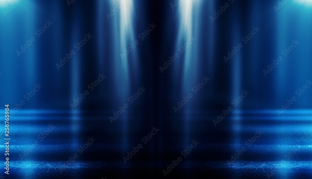Background of empty dark room with rays of light. Concrete floor with light reflection. Smoke, neon blue light Background of empty dark room with rays of light. Concrete floor with light reflection. Smoke, neon blue light