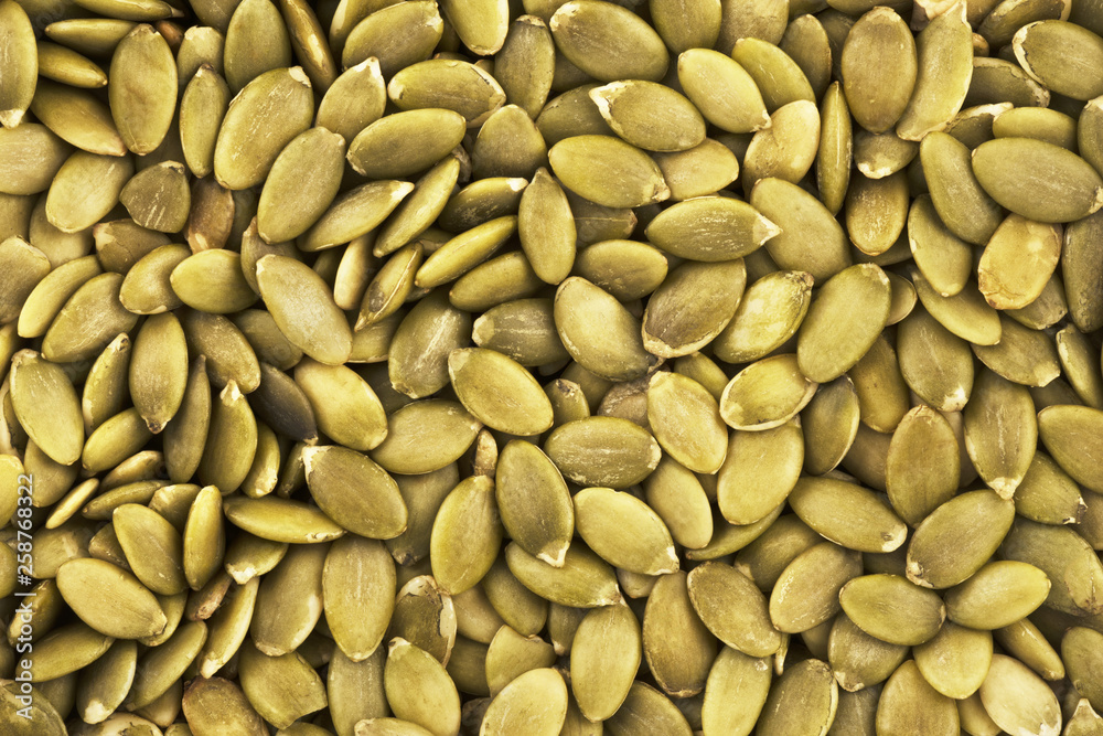 Top view on background texture of pumpkin seeds. Copy space for text. Top view on background texture of pumpkin seeds. Copy space for text.