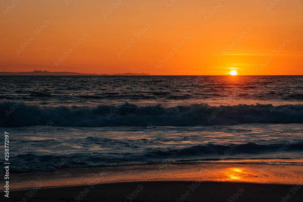 Sunset and waves in Pacific Ocean at Thousand Steps Beach, in Laguna Beach, Orange County, California Sunset and waves in Pacific Ocean at Thousand Steps Beach, in Laguna Beach, Orange County, California