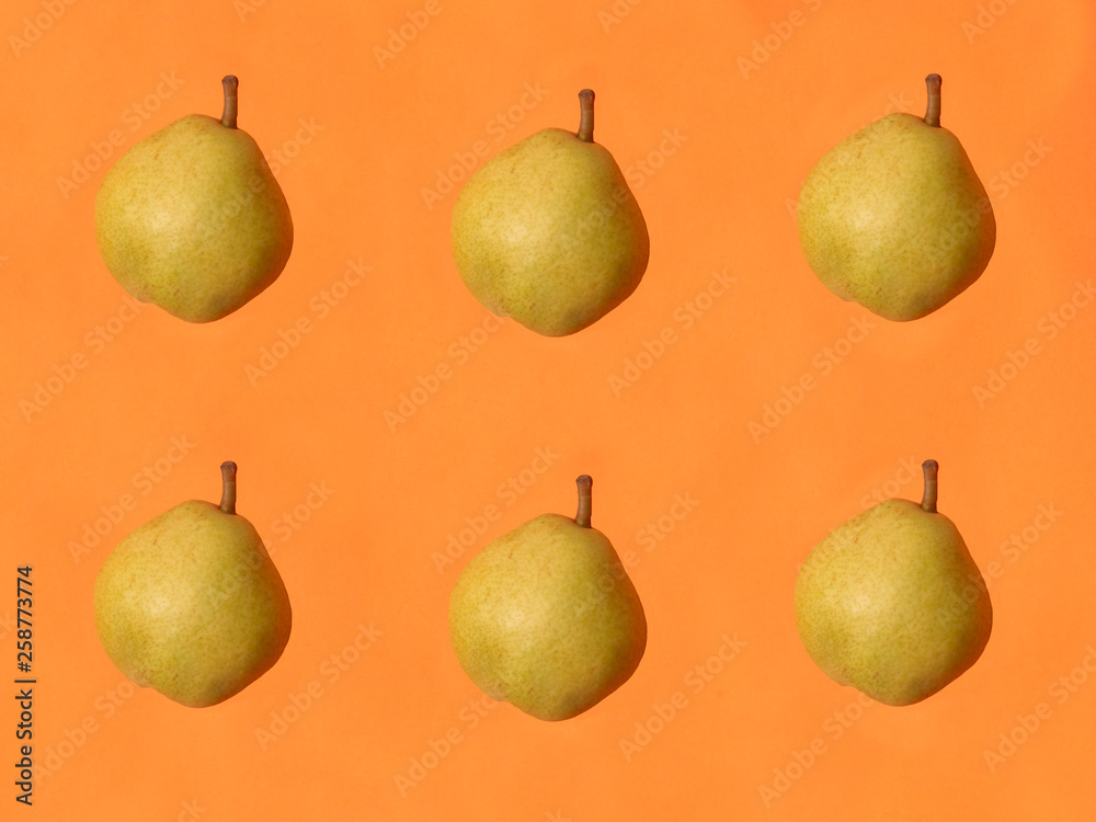 organic pear on oranj background organic pear on oranj background