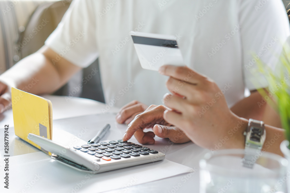 Comfort e-commerce shopping, Asian couple shopping online and payment by credit card. Comfort e-commerce shopping, Asian couple shopping online and payment by credit card.