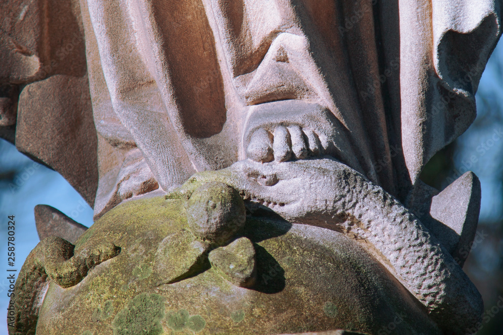 Religious symbol of Christianity The Virgin Mary crushing the serpent