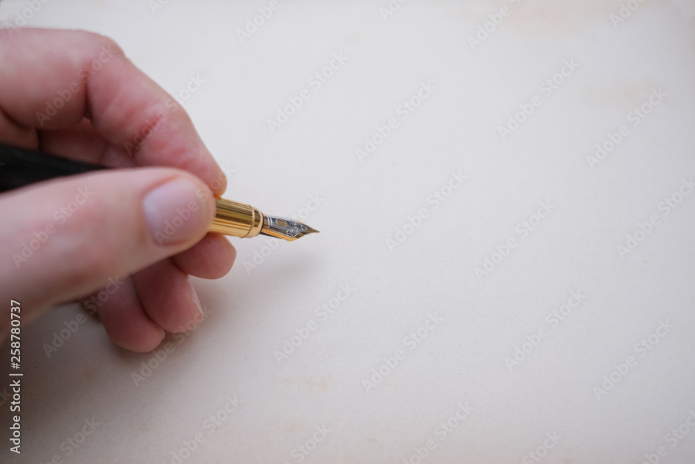 Handle in hand against the background of old paper. Handle in hand against the background of old paper.