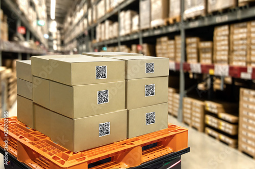 Smart logistic industry 4.0 , QR Codes Asset warehouse and inventory management supply chain technology concept. Group of boxes in storehouse can check product inside and order pick time. photo