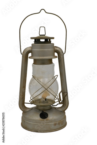 Old iron kerosene lamp. Isolate on a white background.