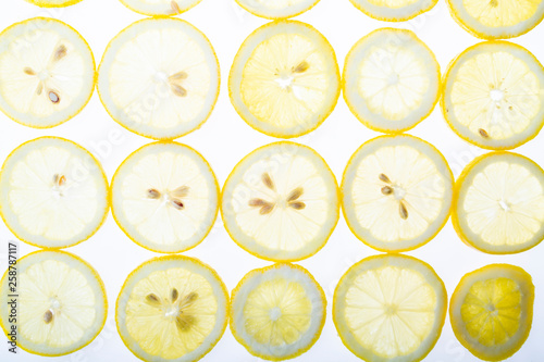 Fruit background with lemon . Slices of juicy lemon and kiwi top view
