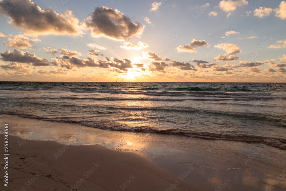Sunset over the beach of the Mayan Riviera in Tulum, Quintana Roo, Mexico