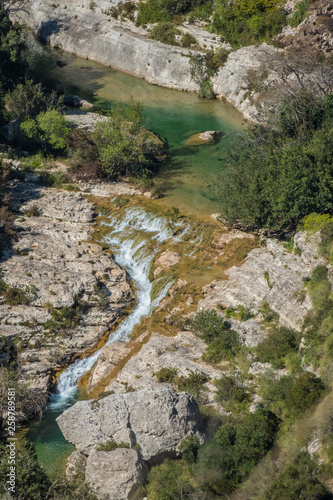 Fototapeta Naklejka Na Ścianę i Meble -  Cava Grande del Cassibile Natural Reserve, Siracusa, Sicily, Italy. One of Europe’s biggest canyons, dug by the river Cassabile through majestic mountains and filling emerald lakes and waterfalls.