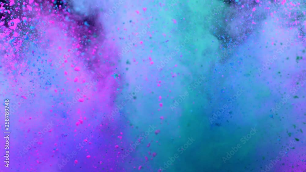 Super slowmotion shot of color powder explosion isolated on black background.