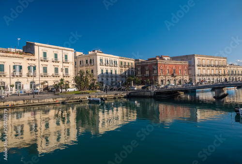 A colorful variety of boats and ships fill the docks of the harbors of the island of Ortygia, Syracuse (Siracusa), a historic city on the island of Sicily, Italy.