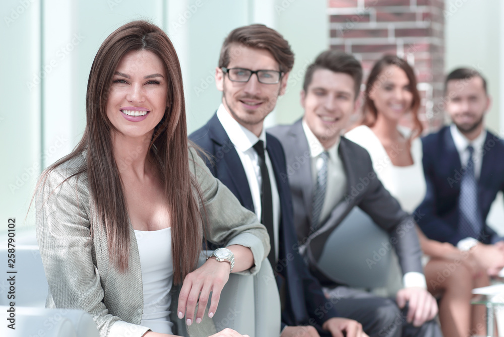 business woman and business team sitting in office business woman and business team sitting in office