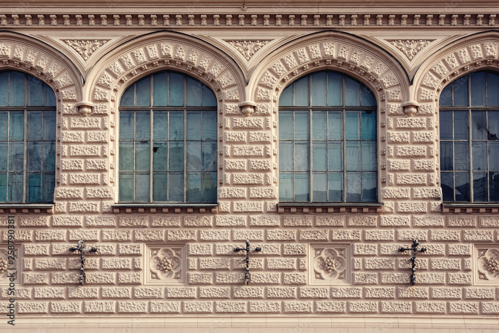 facade of a historic building with frontal windows facade of a historic building with frontal windows