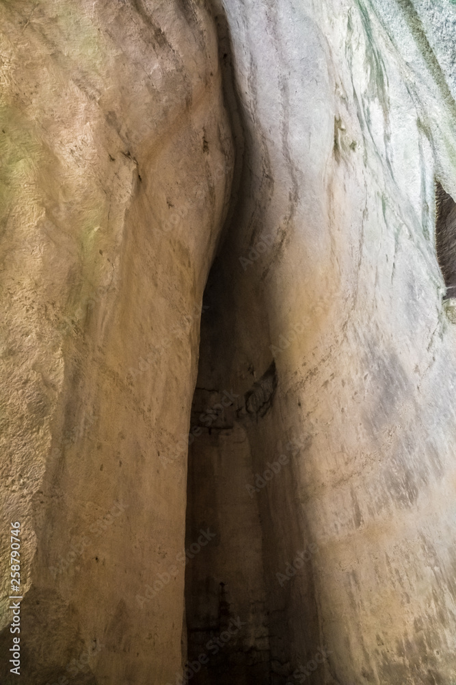 The Ear of Dionysius (Orecchio di Dionisio) a limestone cave carved in ancient times in Syracuse (Siracusa), Sicily, Italy. The Ear of Dionysius (Orecchio di Dionisio) a limestone cave carved in ancient times in Syracuse (Siracusa), Sicily, Italy.