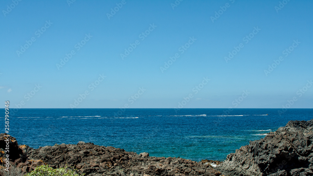 Water skiing on the sea near the coast