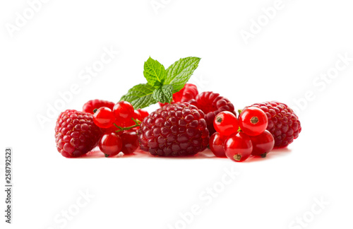 Ripe currants and raspberries. Ripe berries close-up. Background of mix berries with copy space for text. Mix berries isolated  on white background. Various fresh summer.