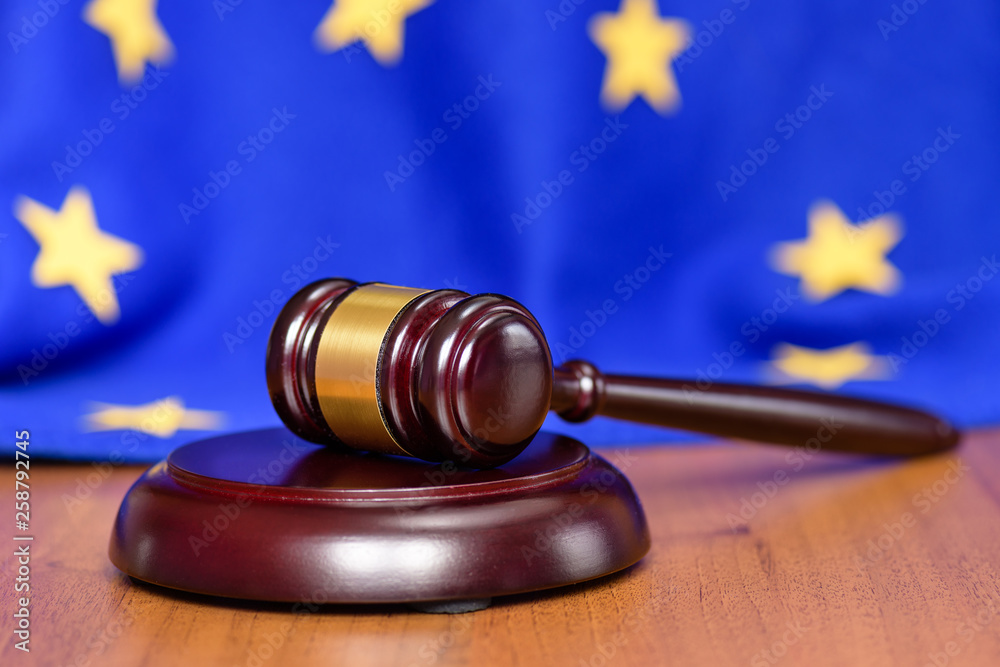 Mild brexit Europe. Collapse of the European Union. EU flag on the background of the judge's gavel. Free Europe and out of it.