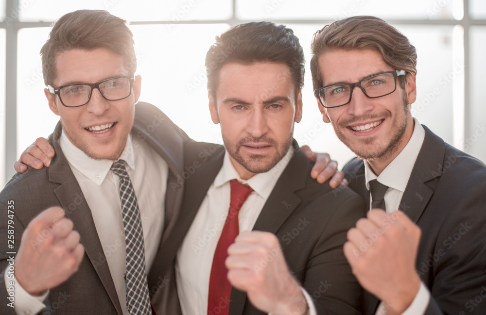 Fototapeta premium close up.three happy businessmen