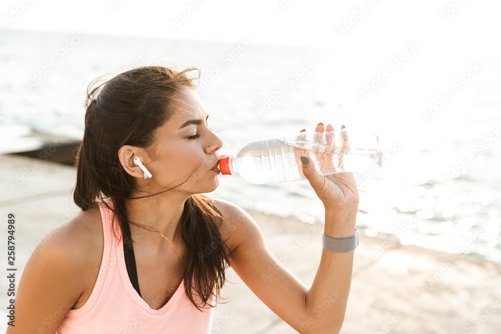 Attractive young fitness woman wearing sportswear Attractive young fitness woman wearing sportswear