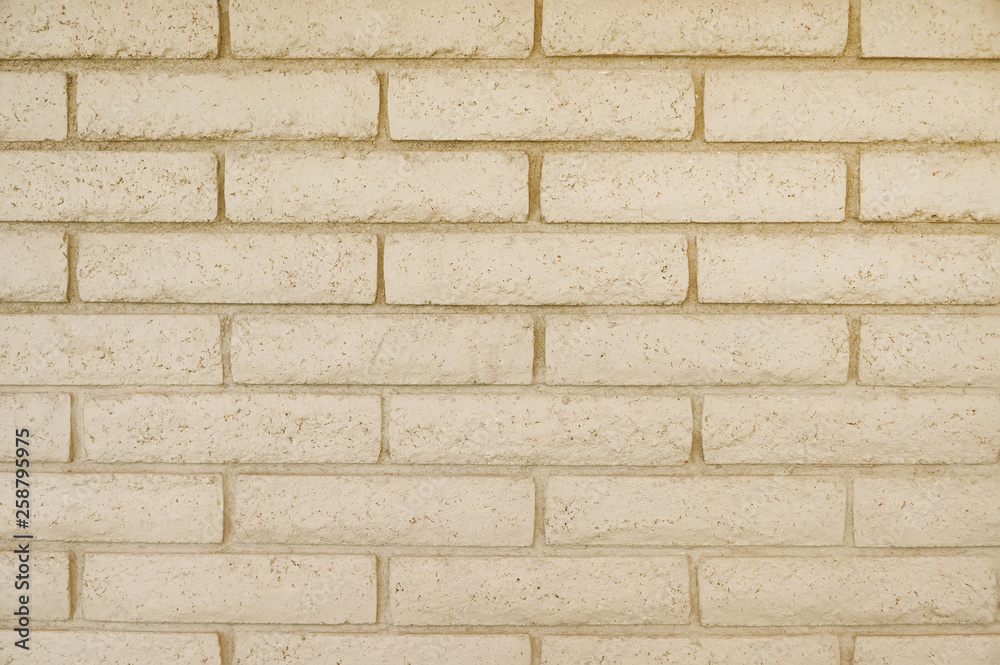 Old beige brick wall background texture Old beige brick wall background texture