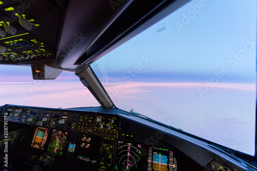 Fototapeta Beautiful twilight sunset sky at high altitude from airplane cockpit view