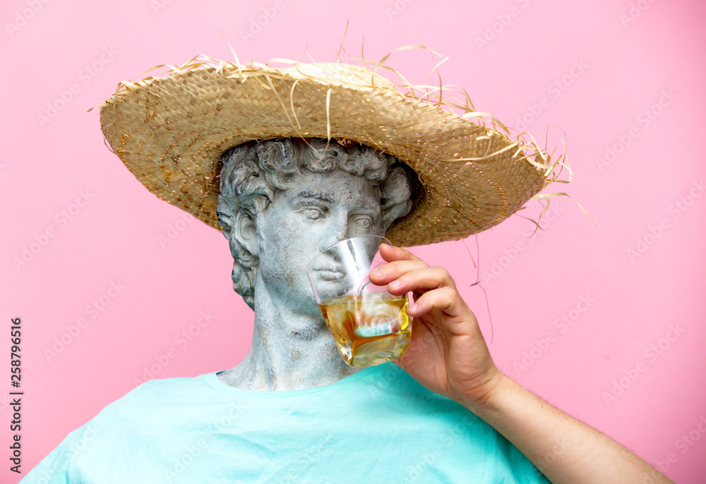 Antique bust of male in hat with whiskey glass - obrazy, fototapety, plakaty 