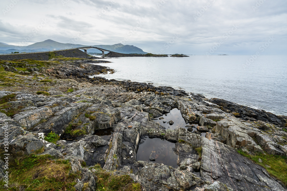 Scenic cloudy landscape with the Atlantic Road in the background, More og Romsdal, Norway.