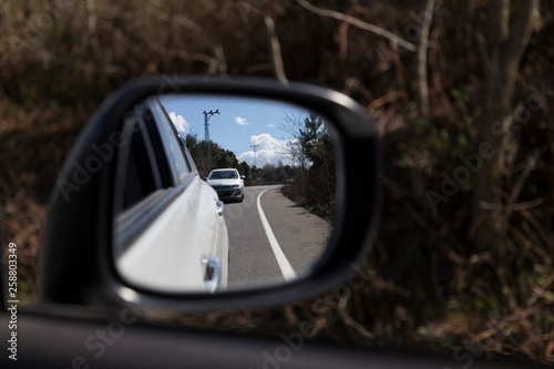 Cars on busy road driving in evening.