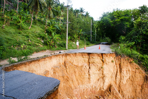 Washout: rain flood damaged badly washed out road in Thailand photo