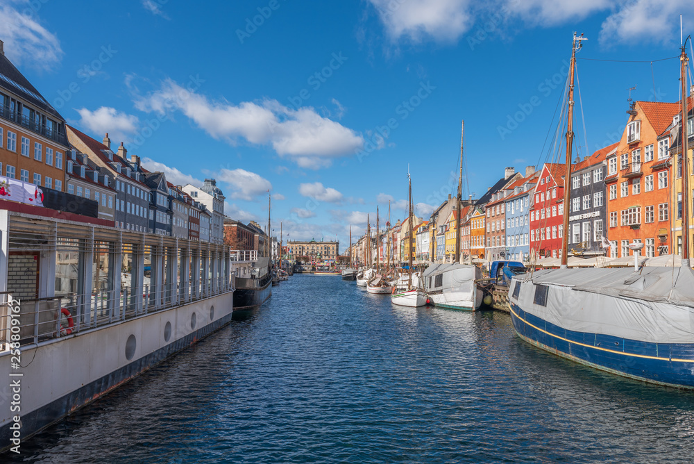 Nyhavn Canal under a blue sky with some clouds