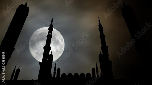 Masjid Al Nabawi or Nabawi Mosque (Mosque of the Prophet) by Night with Full Moon, Medina (City of Lights), Saudi Arabia photo