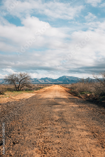 Dirt road and mountains in the desert of eastern Arizona