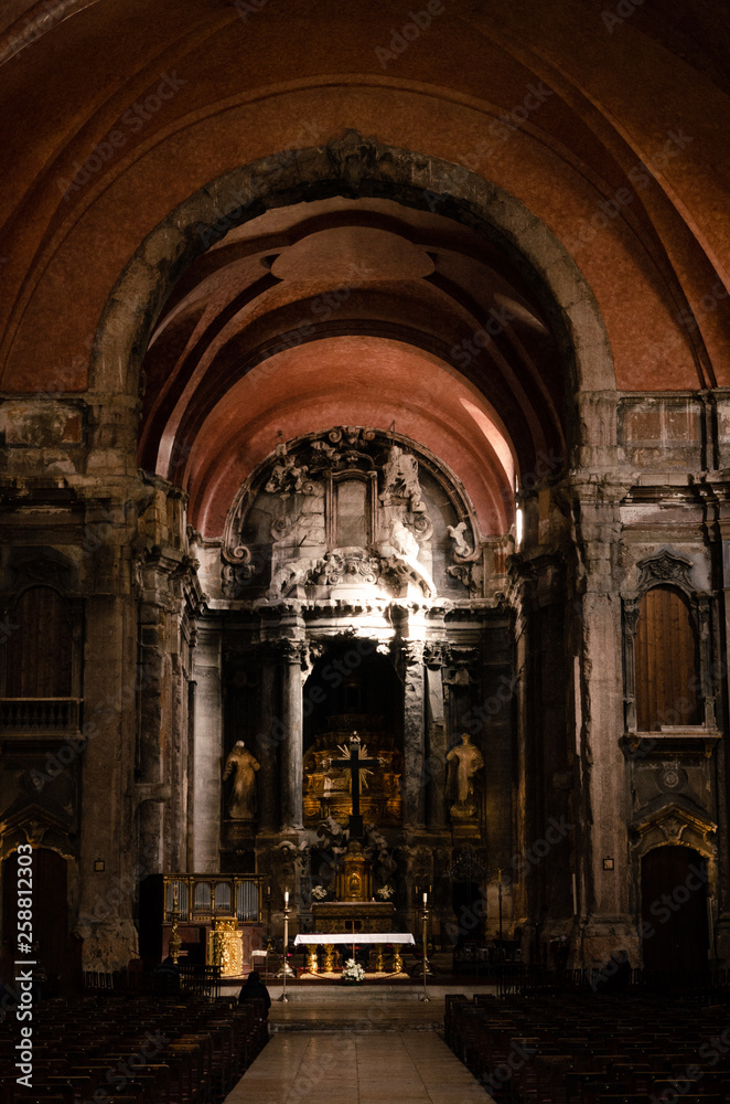 Interior of old, dark, red, burnt down catholic church