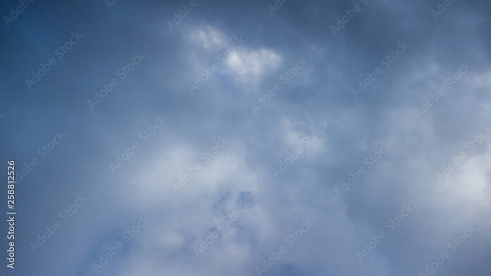 dark blue sky with white clouds