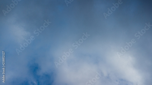 dark blue sky with white clouds