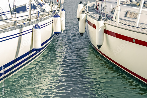 Foto Blue and red motorboats in the marina