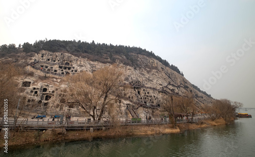 The walk way along the river at the Longmen Grottoes, Luoyang Henan, China. photo