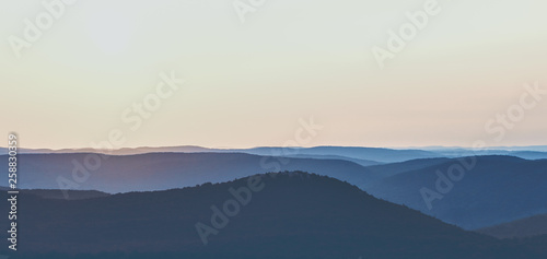 Valokuvatapetti Sunrise Over a Mountain Range